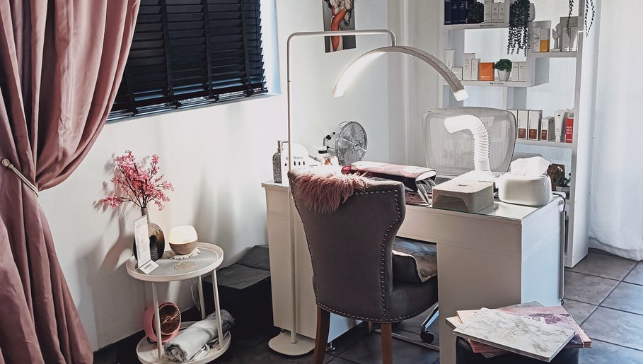 Chic beauty station at Lumé Beauté, Centurion, Gauteng, ZA, featuring plush chair and modern decor.