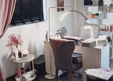 Chic beauty station at Lumé Beauté, Centurion, Gauteng, ZA, featuring plush chair and modern decor.
