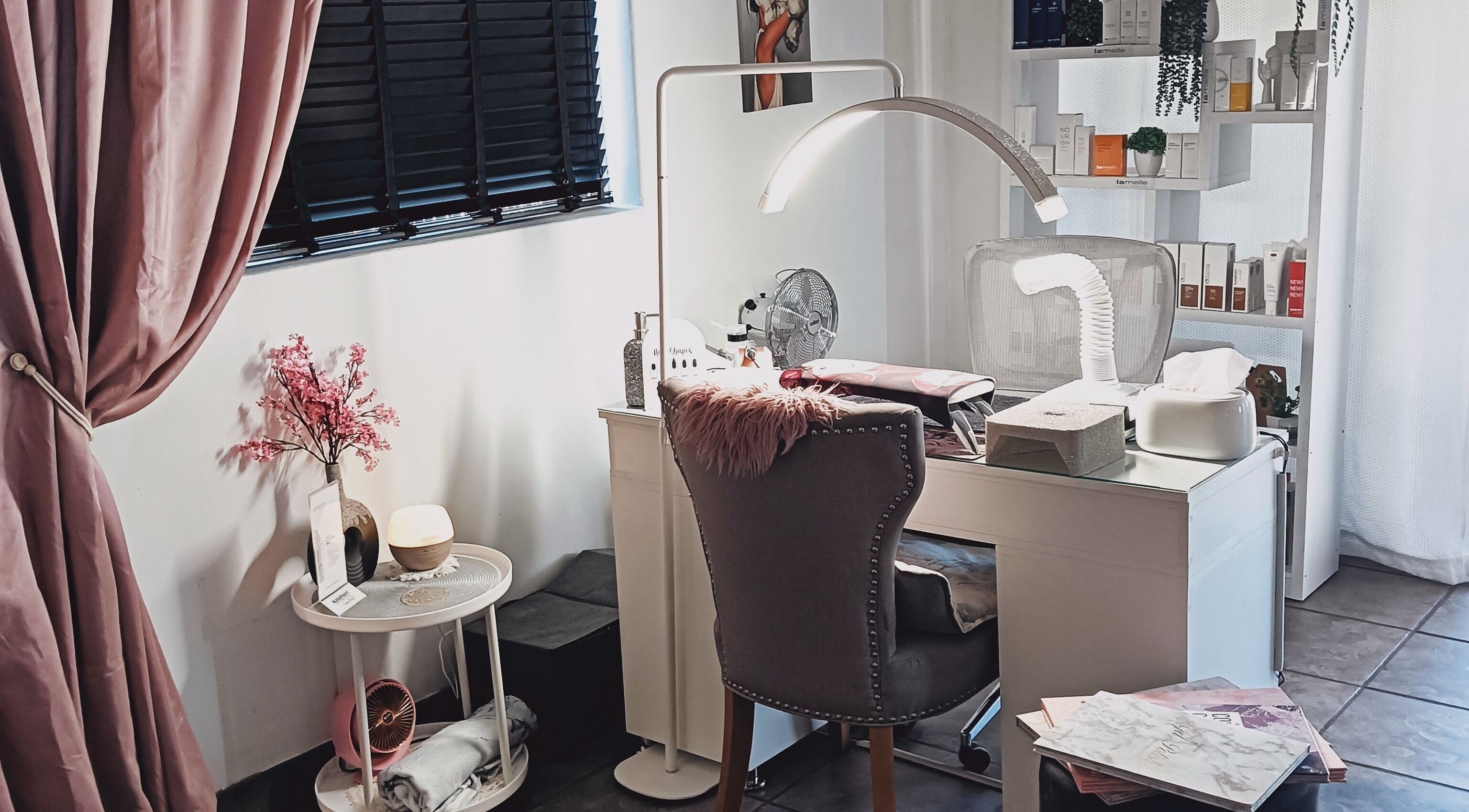 Chic beauty station at Lumé Beauté, Centurion, Gauteng, ZA, featuring plush chair and modern decor.