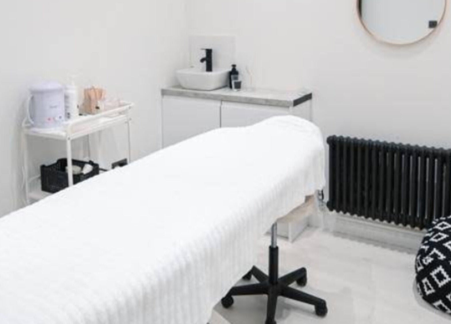 Minks By Mc spa room in Liverpool, England, GB featuring a treatment bed and modern decor.