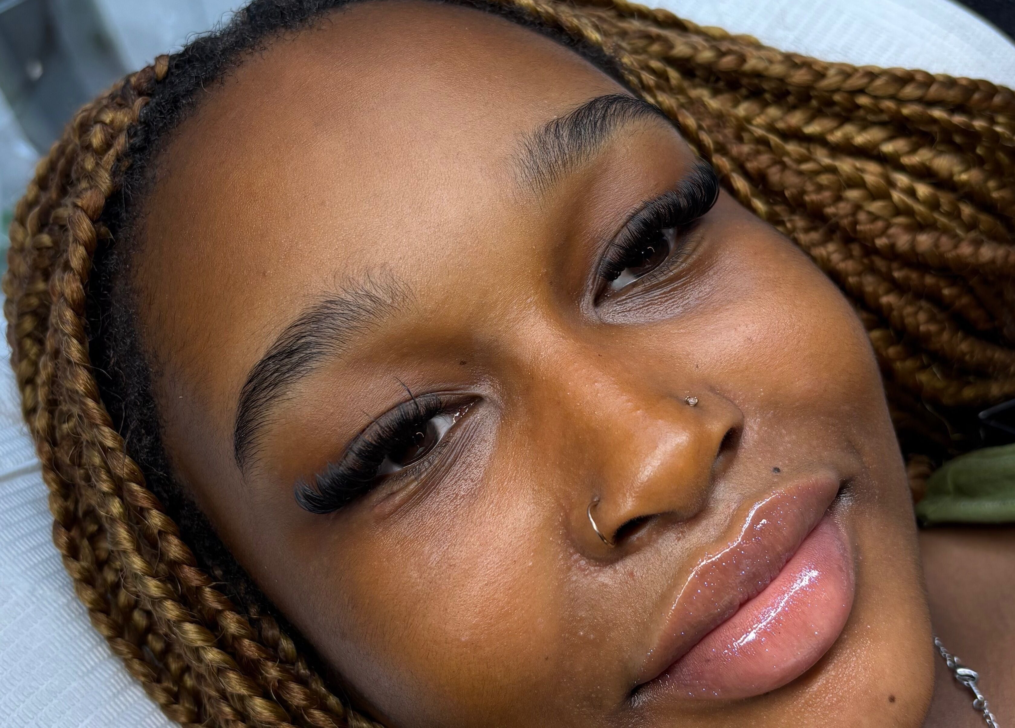 Close-up of eyelash extensions at Minks By Mc, Liverpool, England, GB showcasing beautiful braided hair.