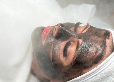 Relaxing facial spa treatment with a charcoal mask at NeuGlo Skin in Burton on Trent, England, GB.