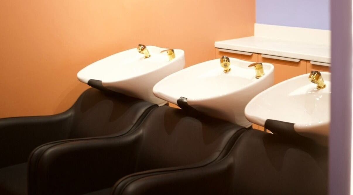 Modern hair wash basins at Hair by Joshuaa Shaun, Birmingham, England, GB offering a serene salon experience.