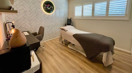 Relaxing treatment room at Zen Body Sculpting, Melbourne, Victoria, AU with modern decor and ambient lighting.