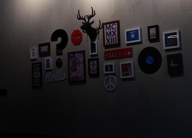 Artistic wall decor featuring frames and symbols at Obai Salon I صالون أبي, Jeddah, Makkah Province, SA.