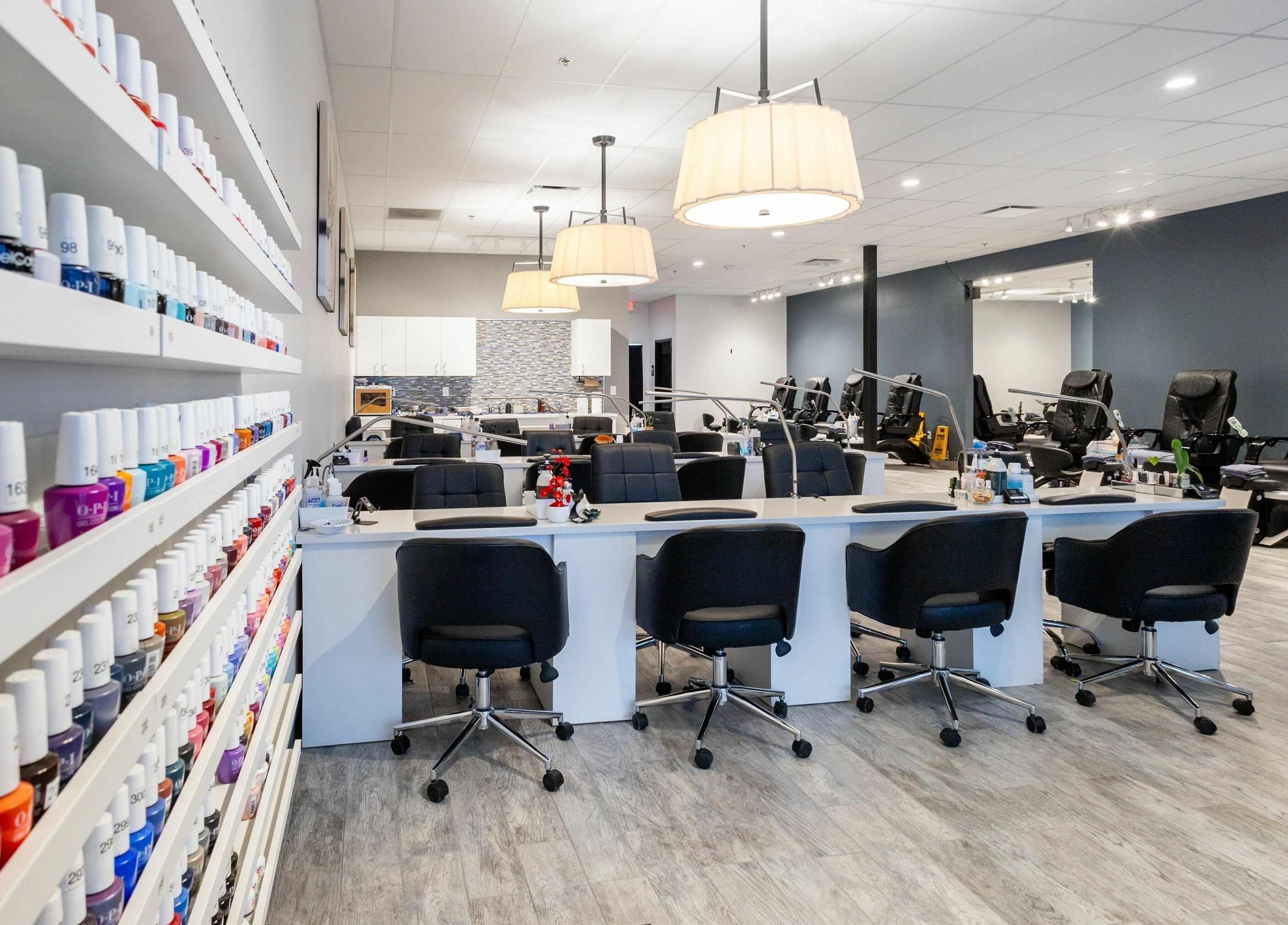 Modern interior of Ruby Nails in Brookfield, Wisconsin, US showcasing nail polish display and seating.