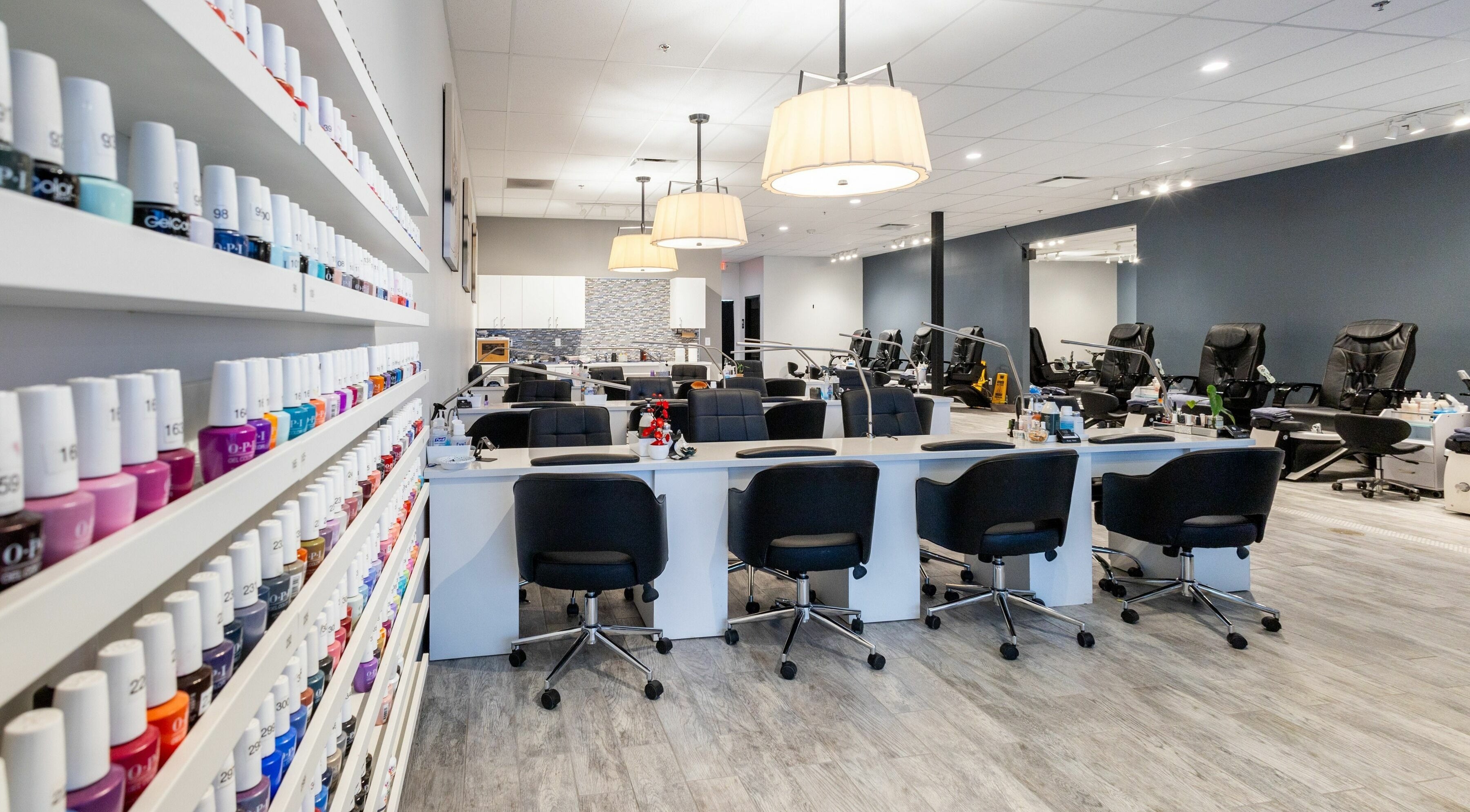 Modern interior of Ruby Nails in Brookfield, Wisconsin, US showcasing nail polish display and seating.