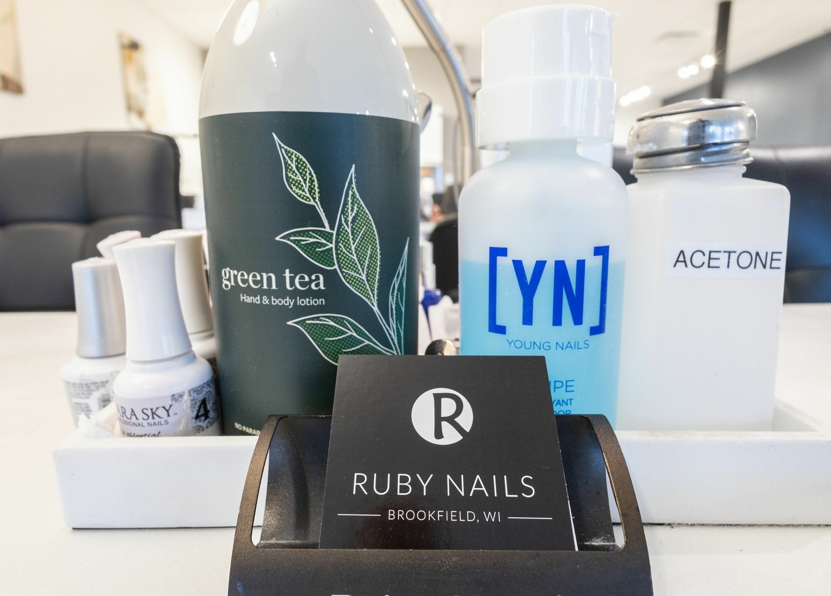 Nail care products at Ruby Nails, Brookfield, Wisconsin showcase a professional salon setup.