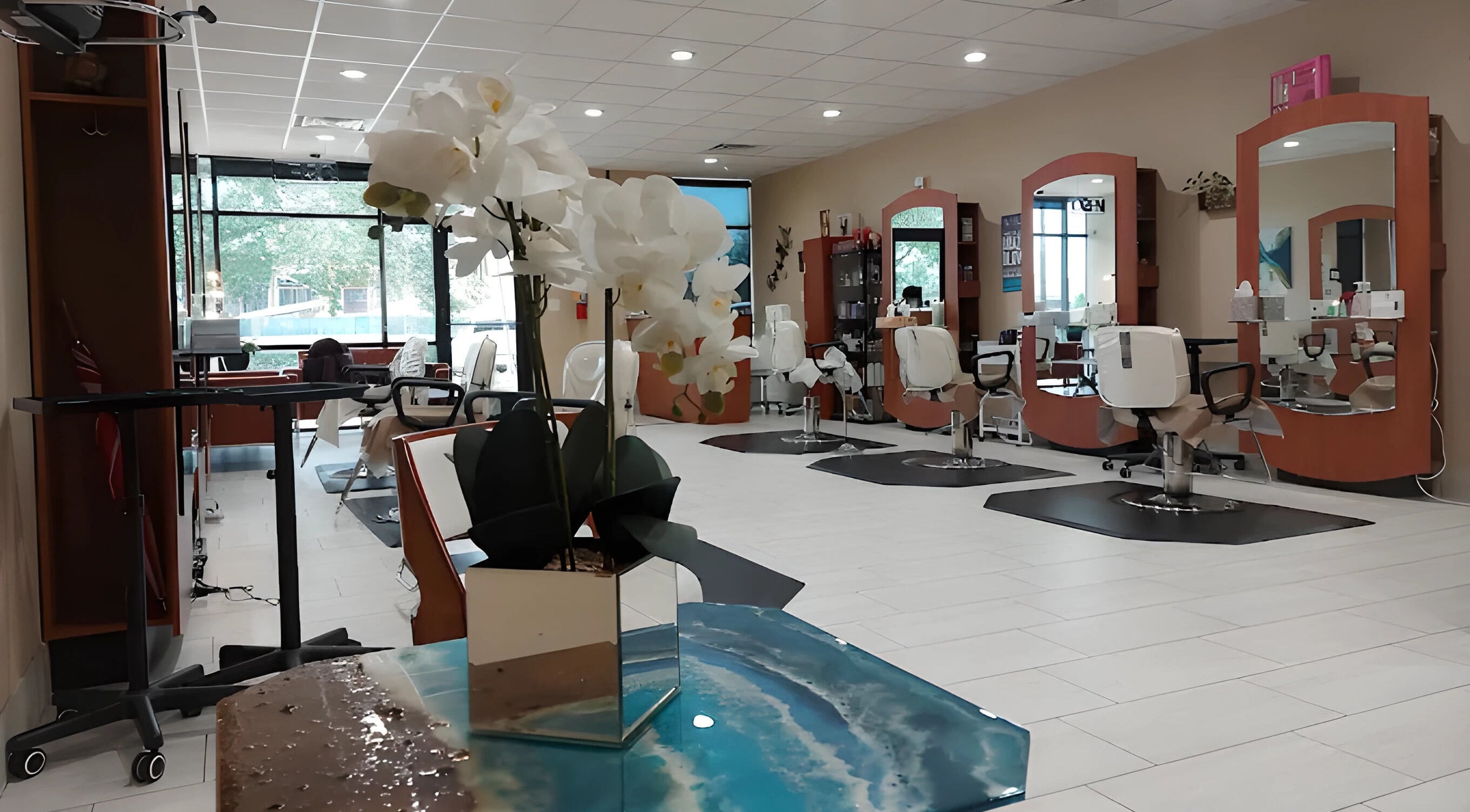 Spacious and elegant interior of Faith Hansen Salon in Missouri City, Texas, US with modern styling chairs.