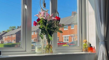 Sunny window with flowers at Beautified by Ella, Preston, England, GB.