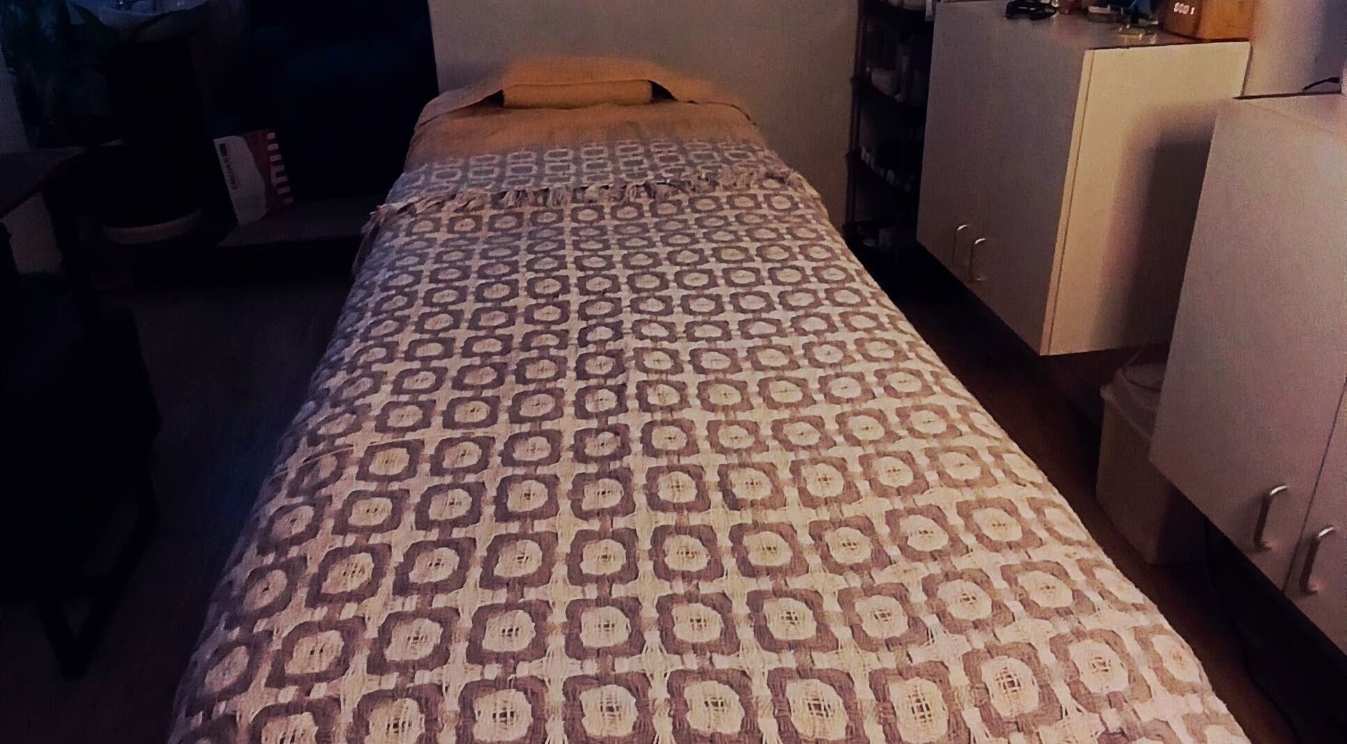 Cozy massage bed in Authentically You Emporium, Cape Town, Western Cape, ZA, ready for relaxation.