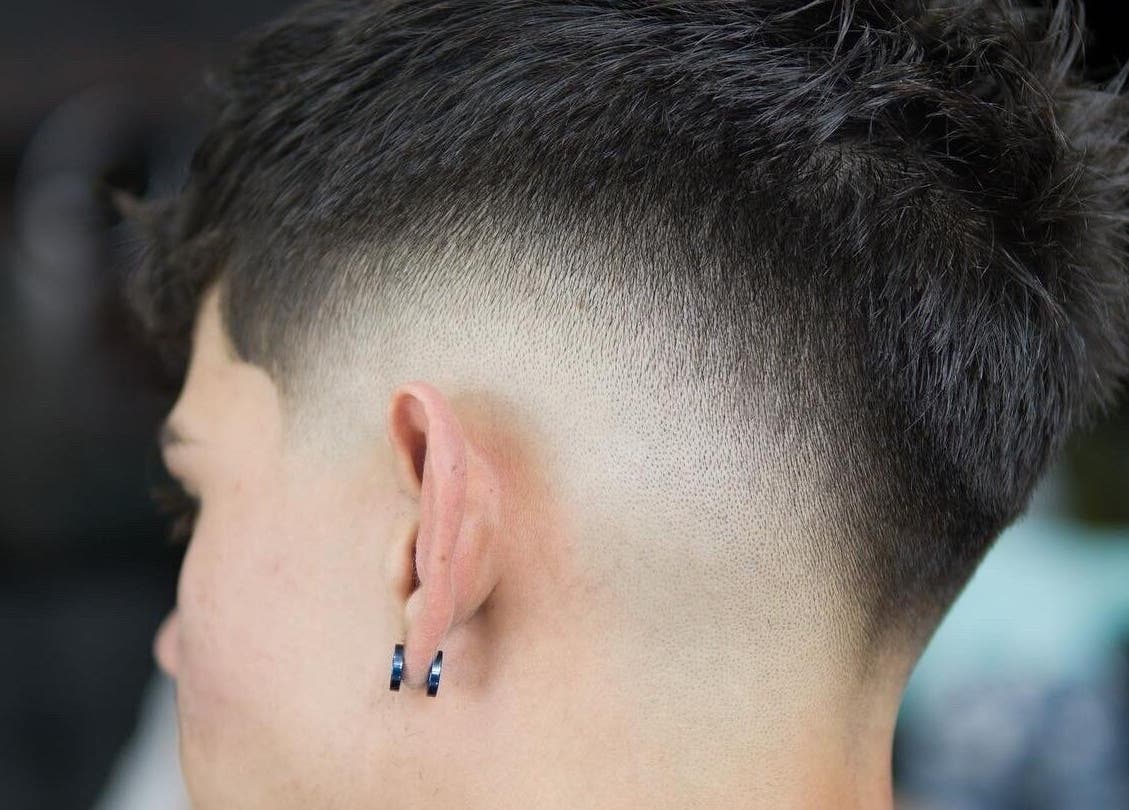 Corte de pelo moderno en Vanguart, Provincia De Alajuela, Provincia De Alajuela, CR, mostrando un estilo degradado.