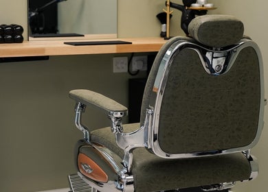 Luxurious styling chair at Garcia Hair Lounge, London, England, GB offers comfort and style in a chic setting.