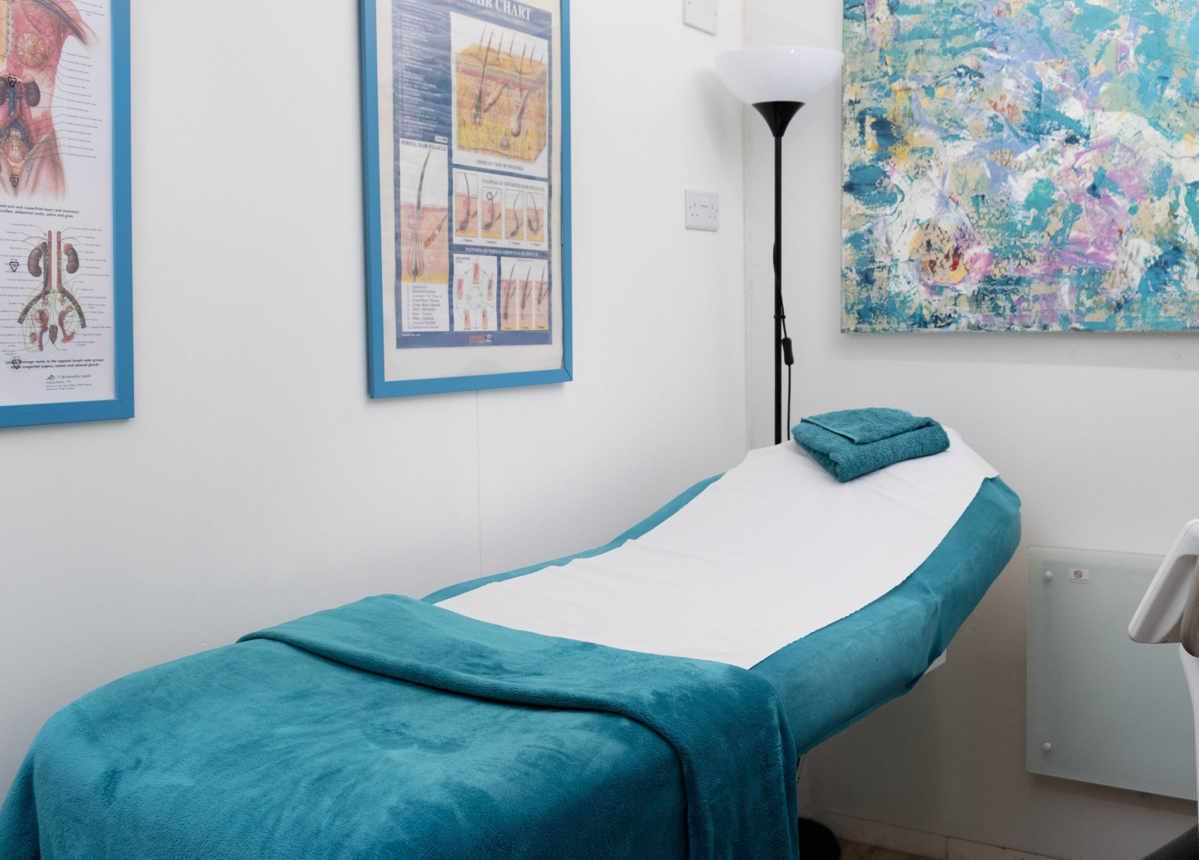 Relaxing treatment room at My Brazilian Wax, London, England, GB with a soothing ambiance and spa bed.