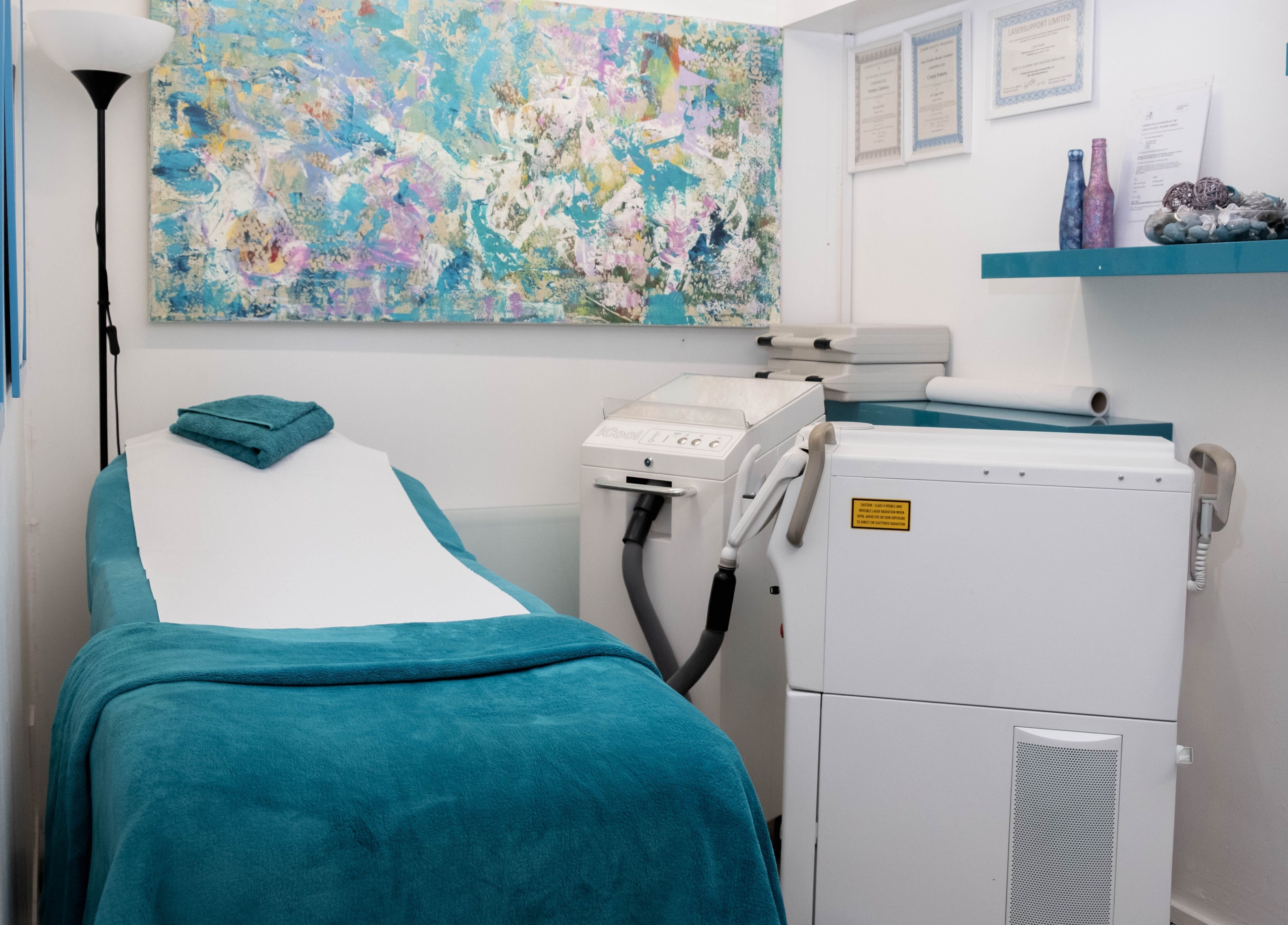 Cozy treatment room at My Brazilian Wax, London, England, GB, featuring a massage bed and calming decor.