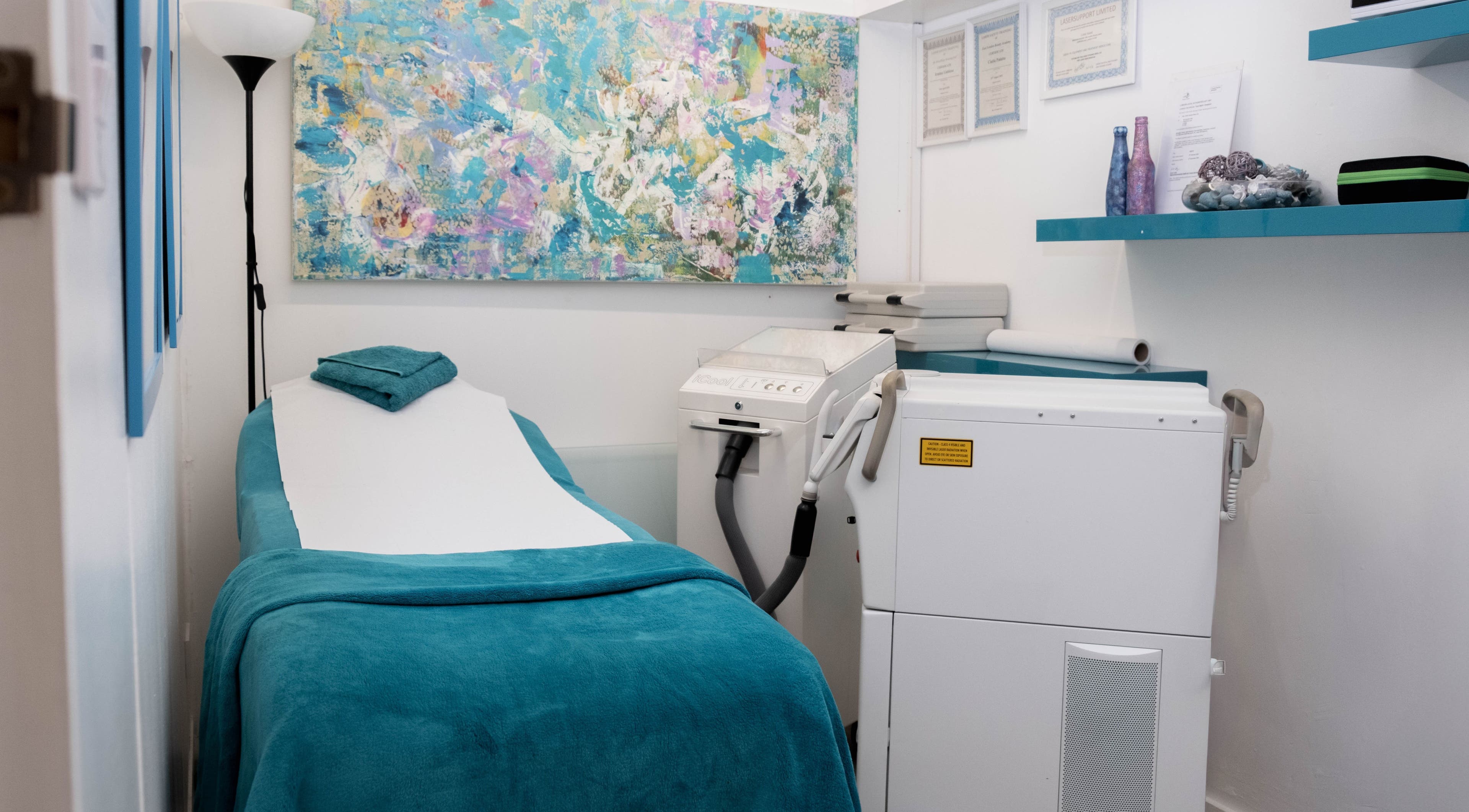 Cozy treatment room at My Brazilian Wax, London, England, GB, featuring a massage bed and calming decor.