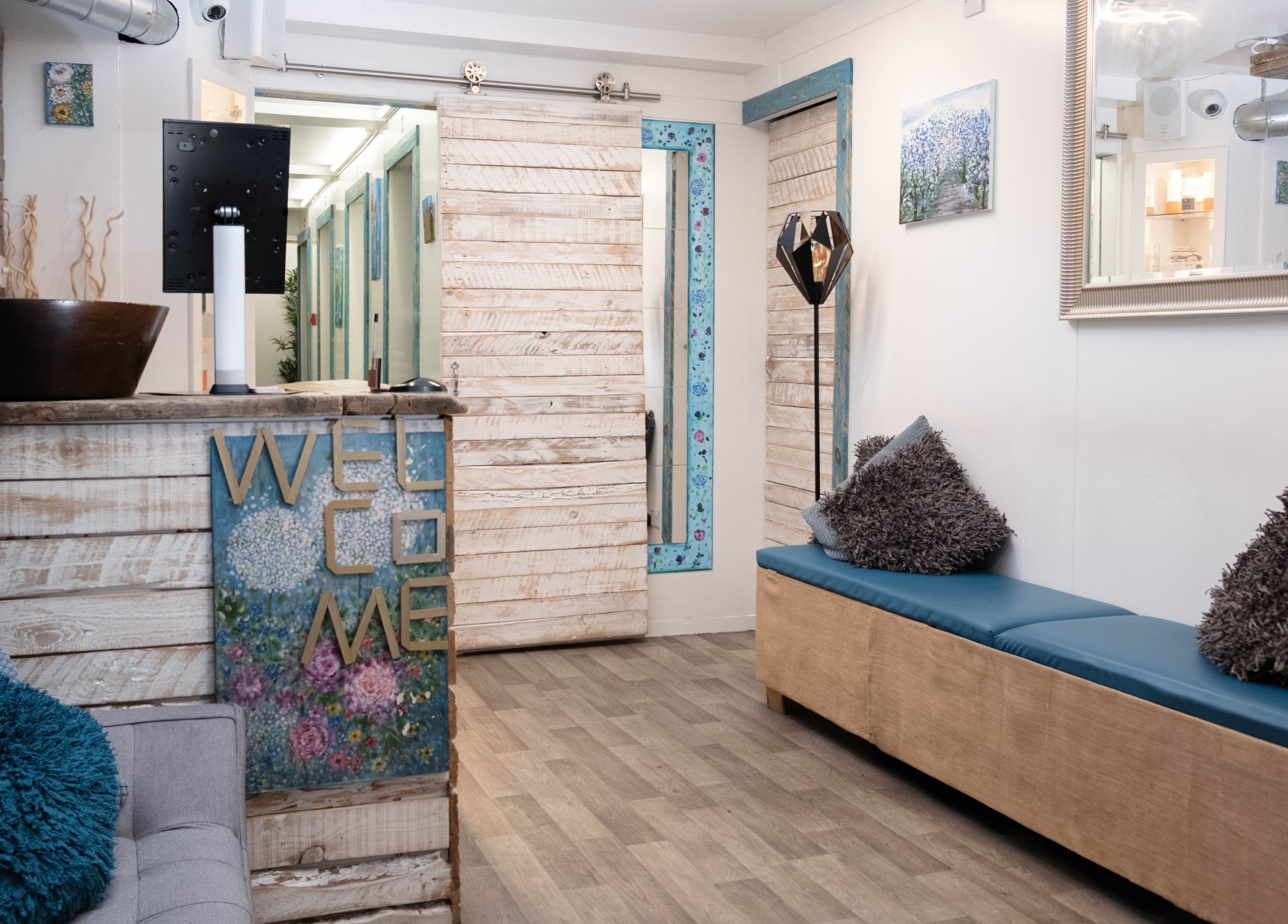 Relaxing reception area of My Brazilian Wax in London, England, GB with cozy seating and rustic decor.