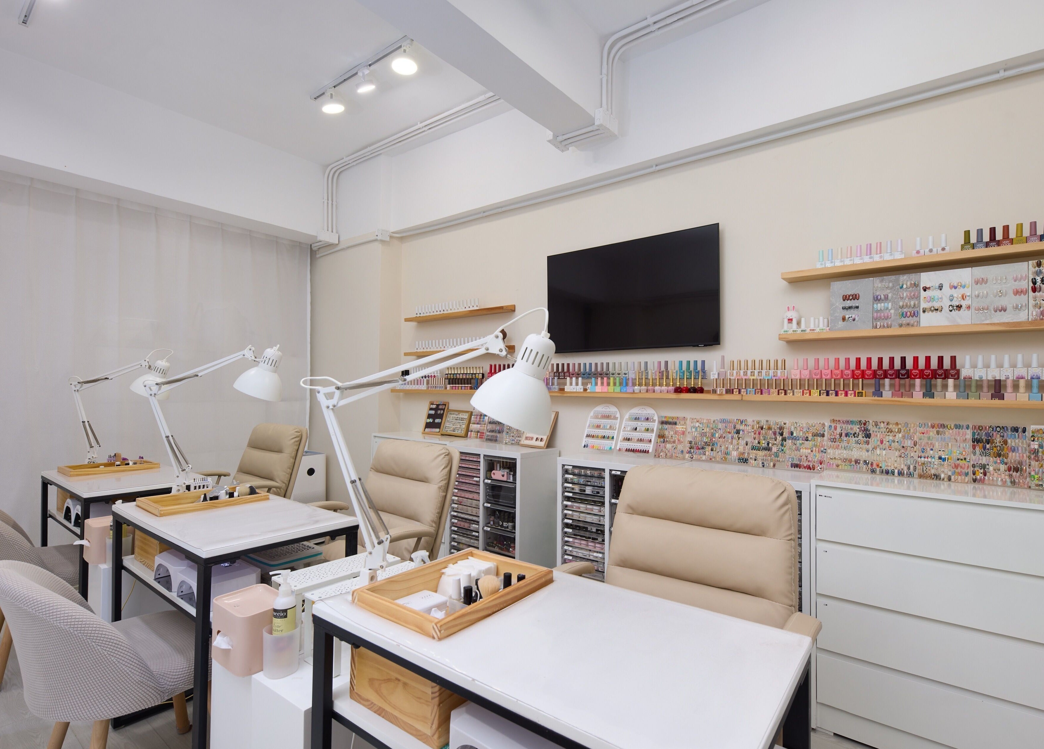 Modern nail salon at Nail Room, 香港島, 香港島, HK with sleek workstations and vibrant polish selection.