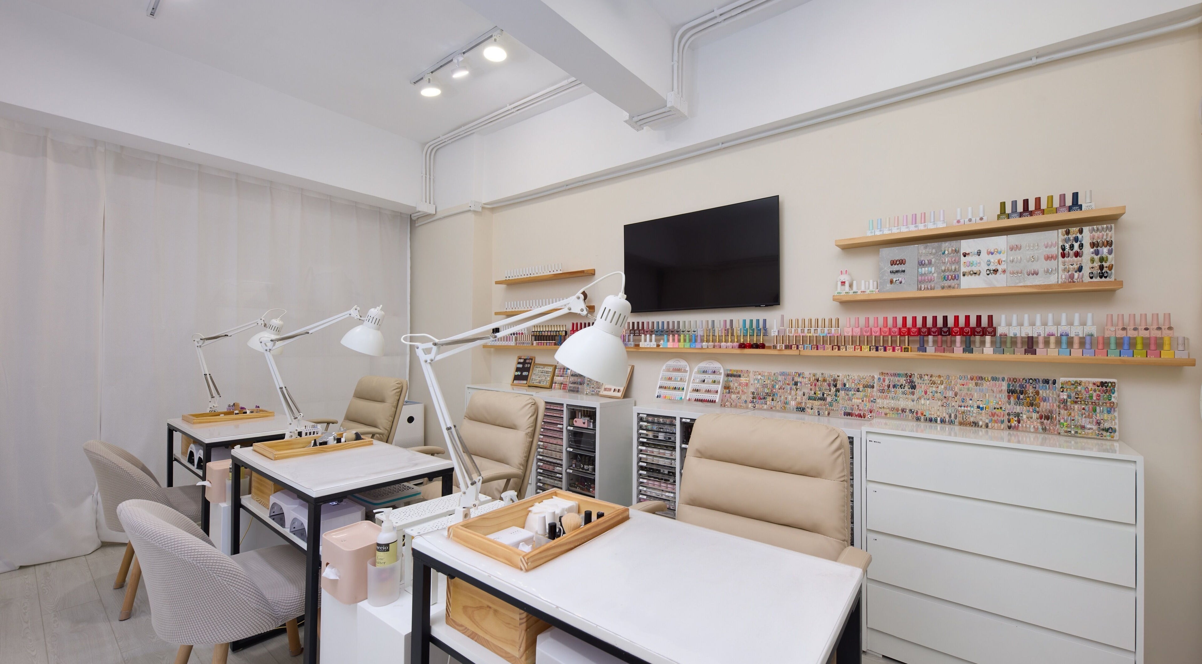 Modern nail salon at Nail Room, 香港島, 香港島, HK with sleek workstations and vibrant polish selection.