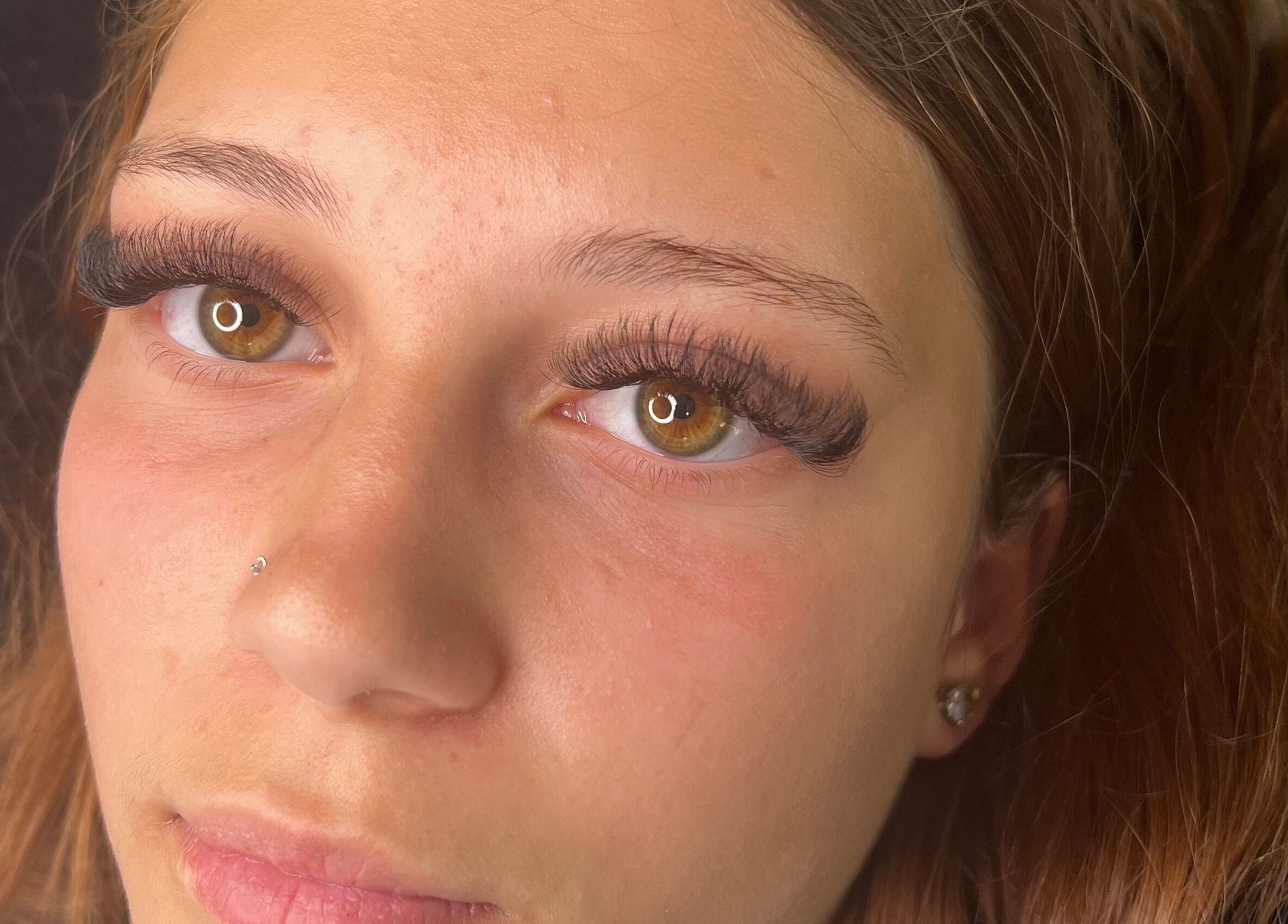 Close-up of woman with elegant eyelash extensions at Glow and Go, Harwich, England, GB.