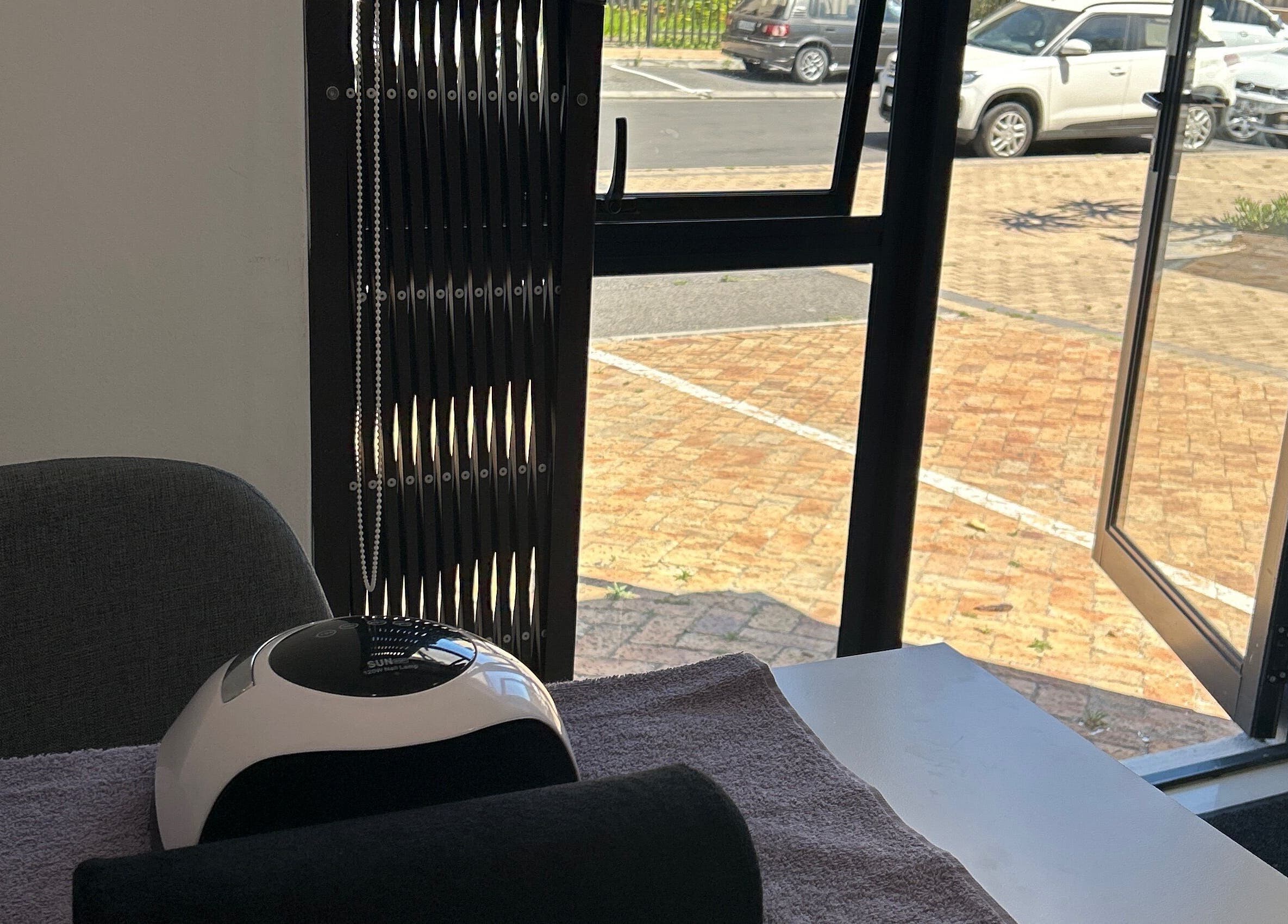 Interior of Amarni Nail & Beauty Spa with a manicure station, Cape Town, Western Cape, ZA.