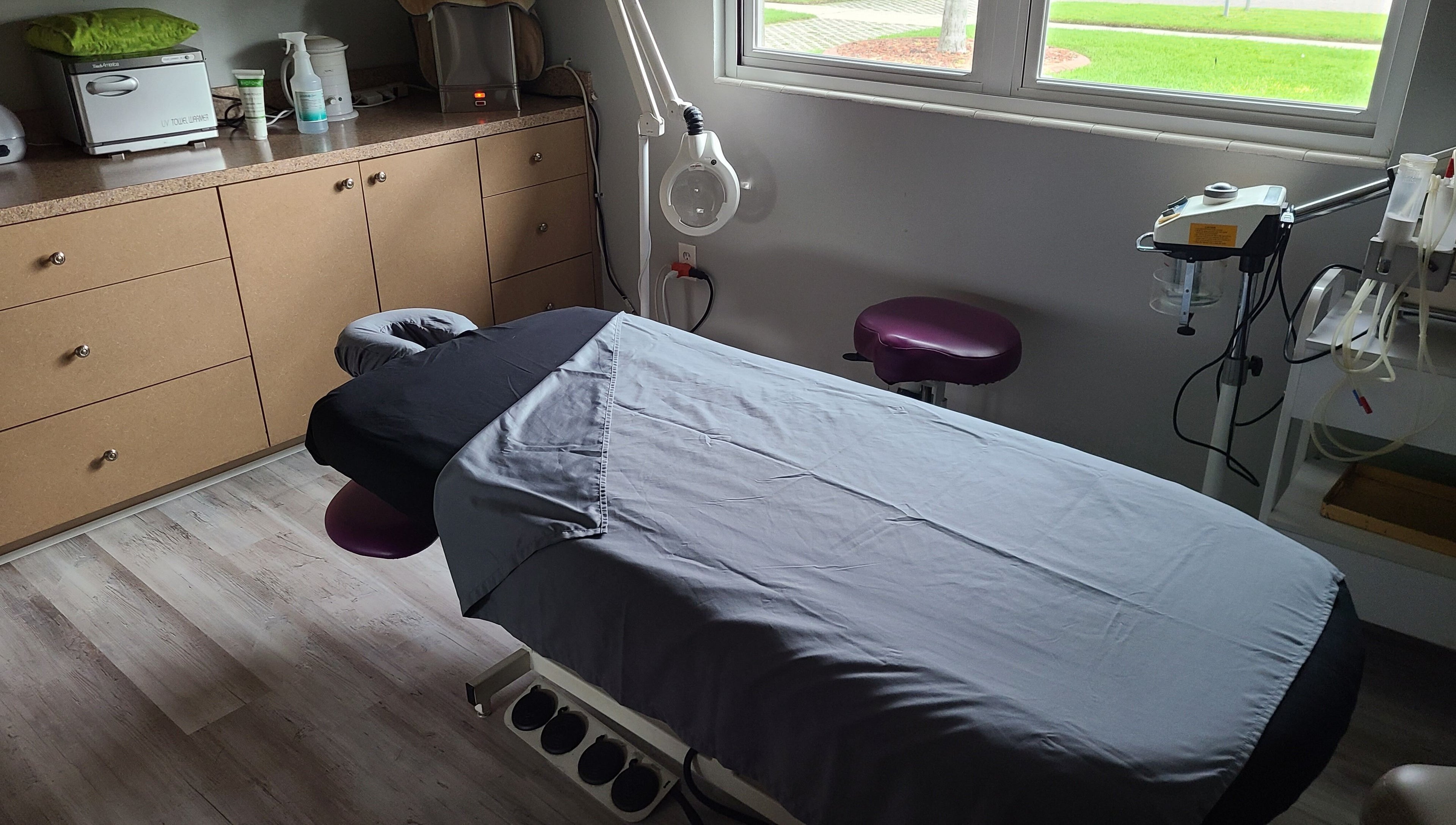 A tranquil massage room at The Muscle Whisperer, New Port Richey, Florida, US, featuring a cozy massage table.