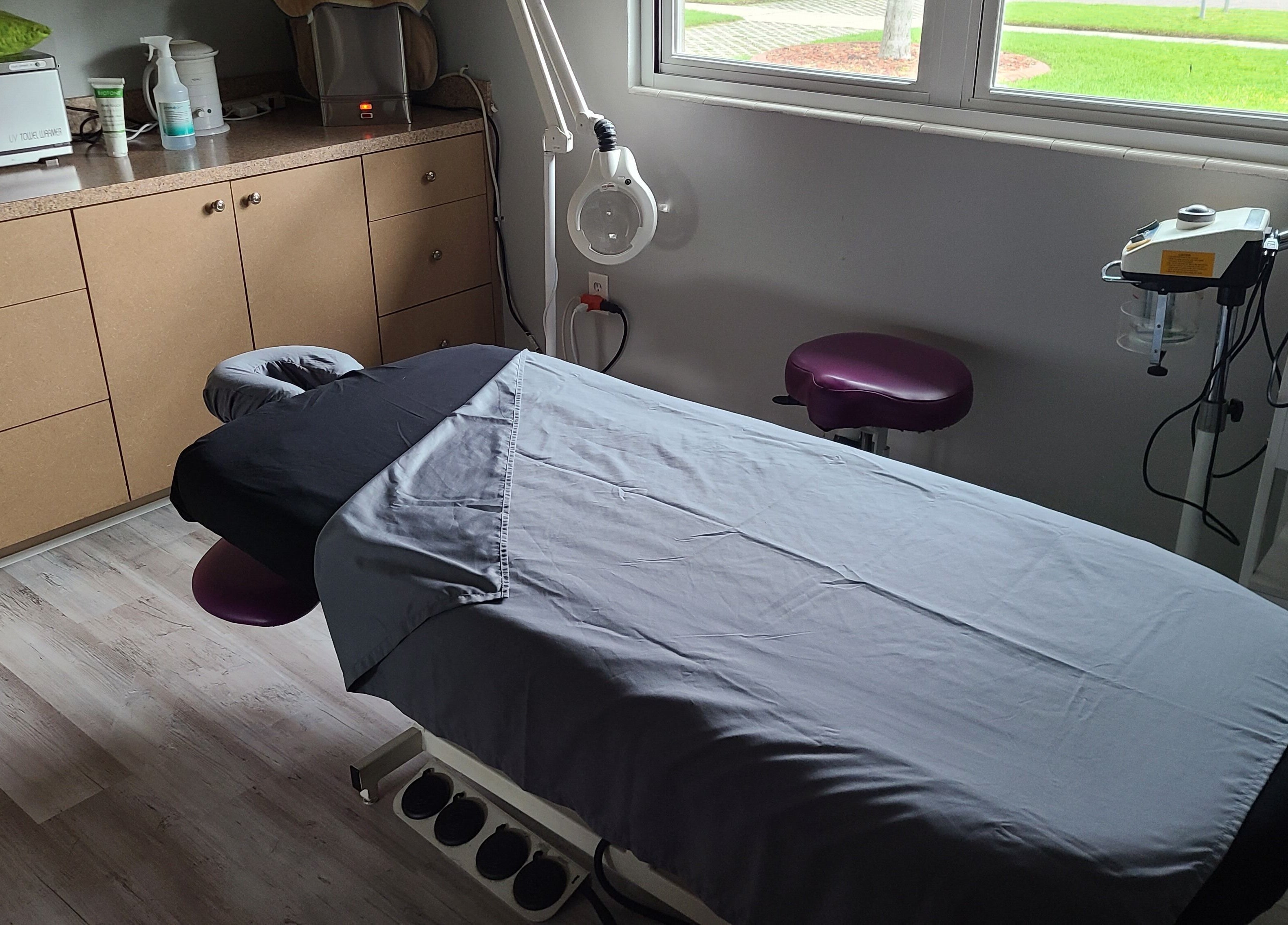 A tranquil massage room at The Muscle Whisperer, New Port Richey, Florida, US, featuring a cozy massage table.