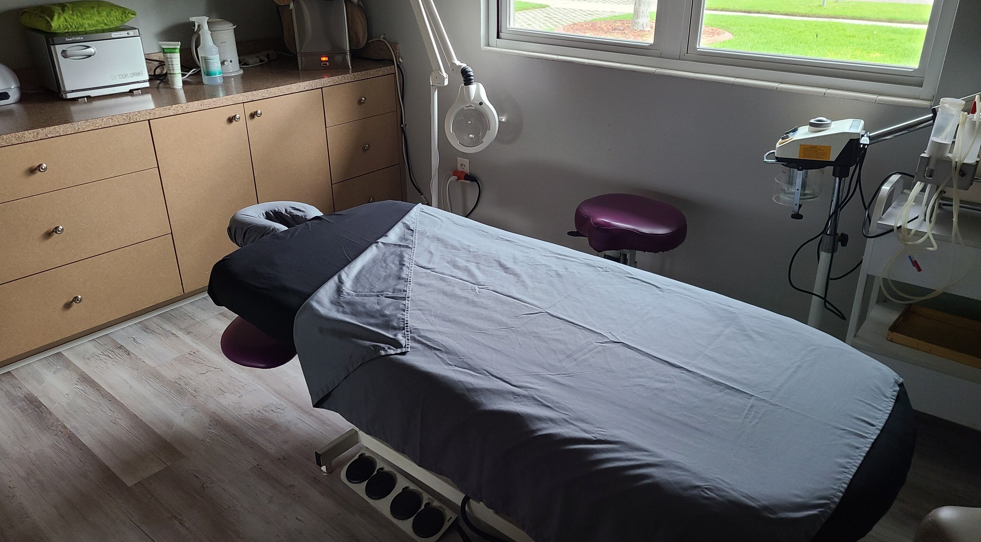A tranquil massage room at The Muscle Whisperer, New Port Richey, Florida, US, featuring a cozy massage table.
