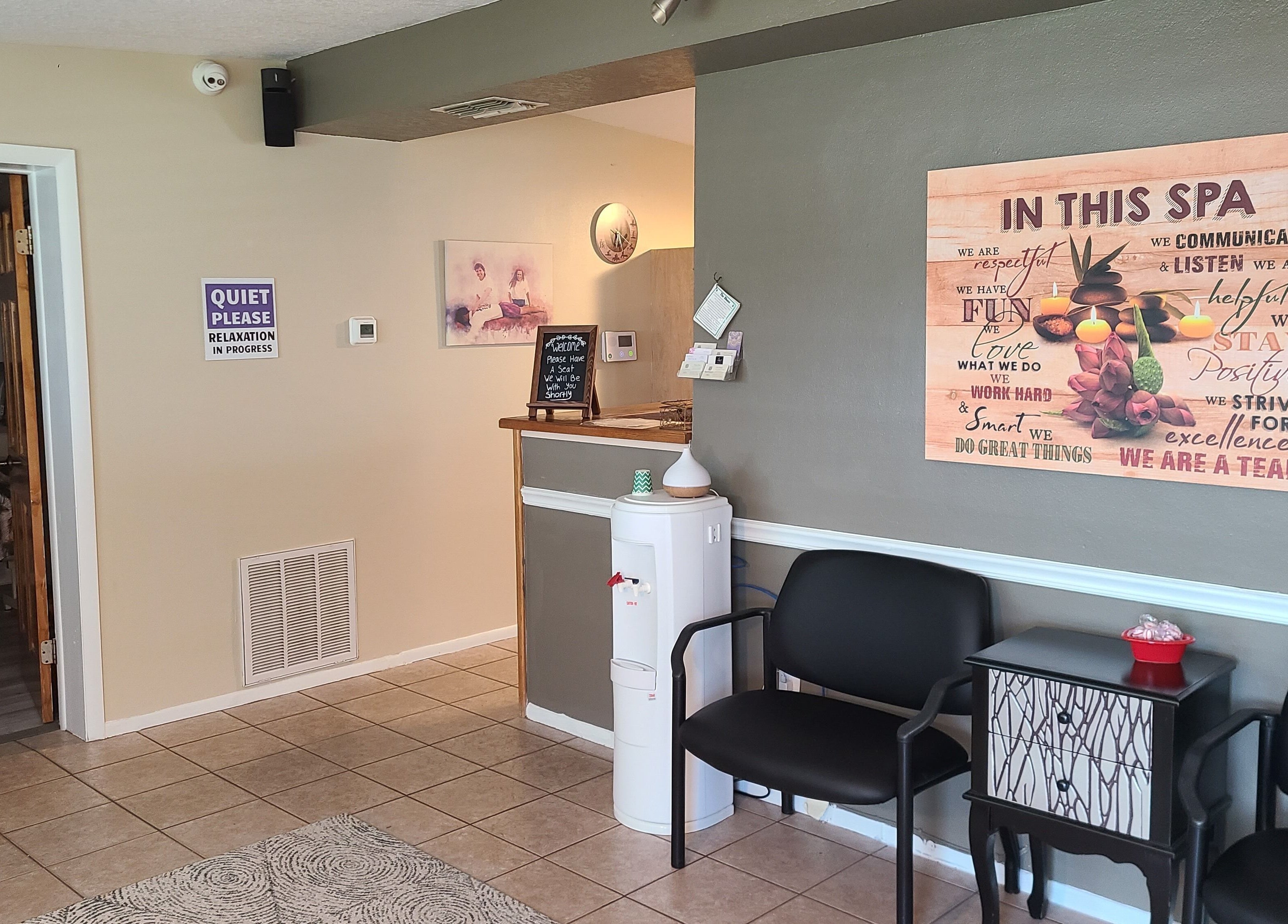 Relaxing waiting area at The Muscle Whisperer, New Port Richey, Florida, US with calming decor.