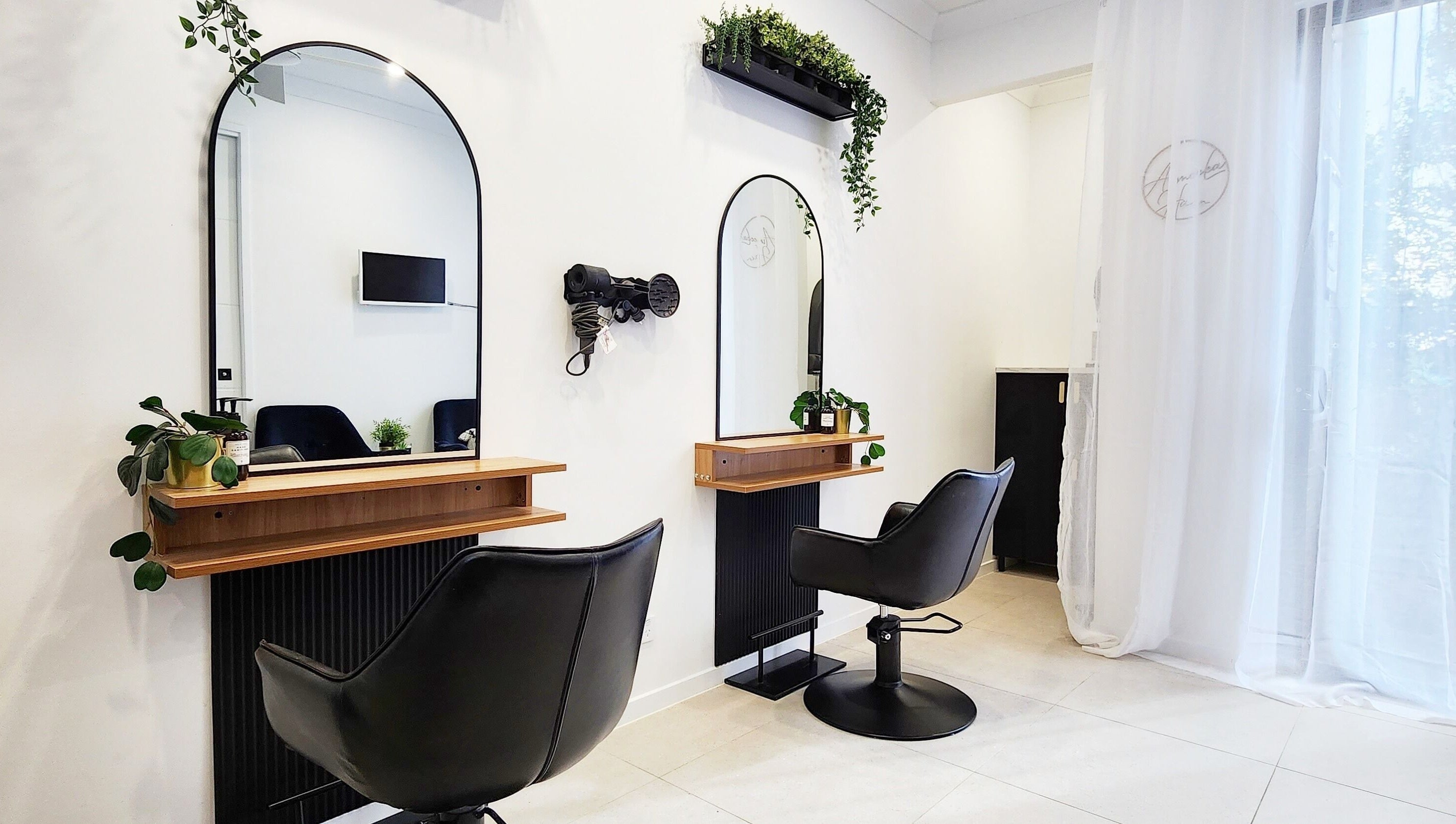 Modern styling chairs and mirrors at AimeeLea Hairdressing, Cornubia, Queensland, AU.