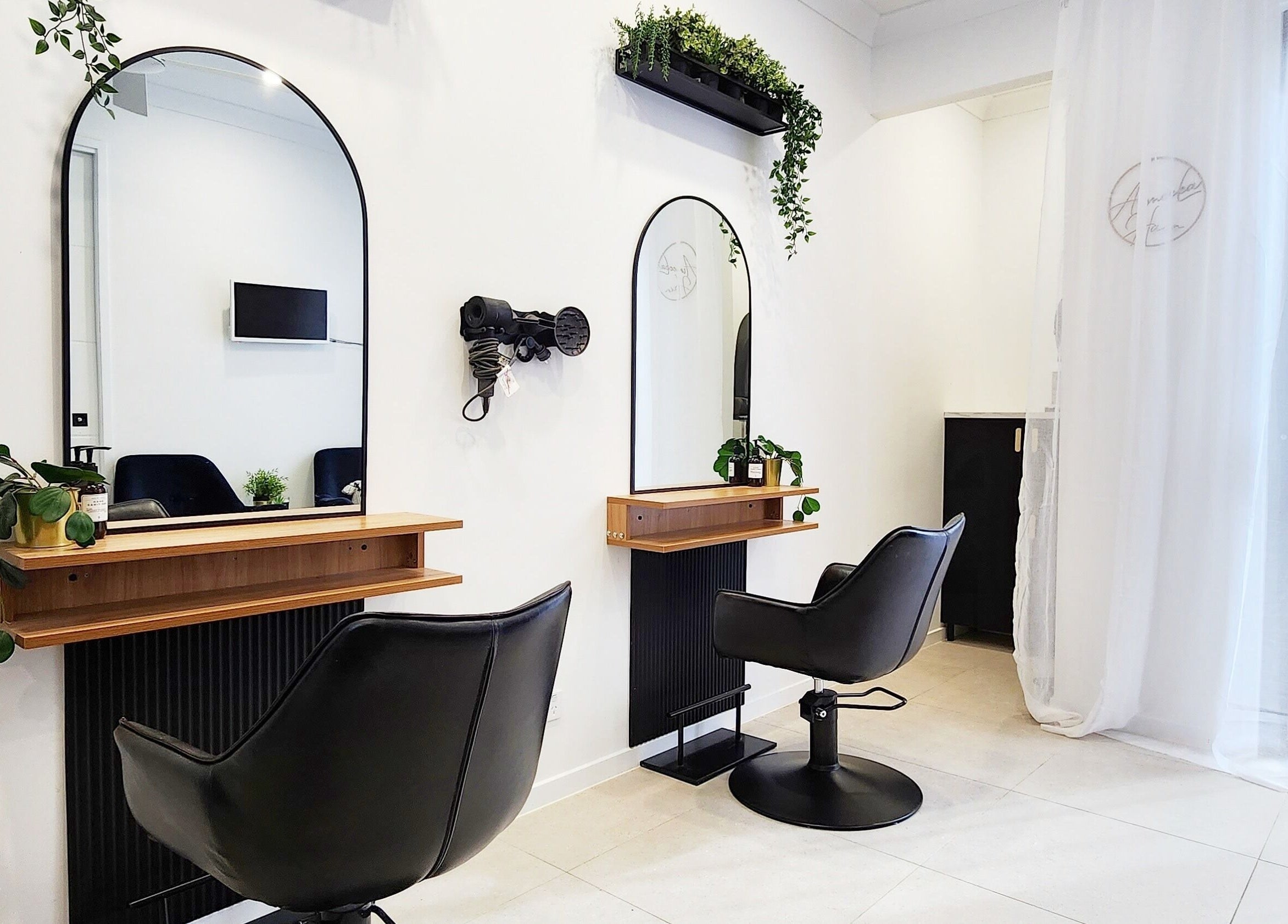 Modern styling chairs and mirrors at AimeeLea Hairdressing, Cornubia, Queensland, AU.