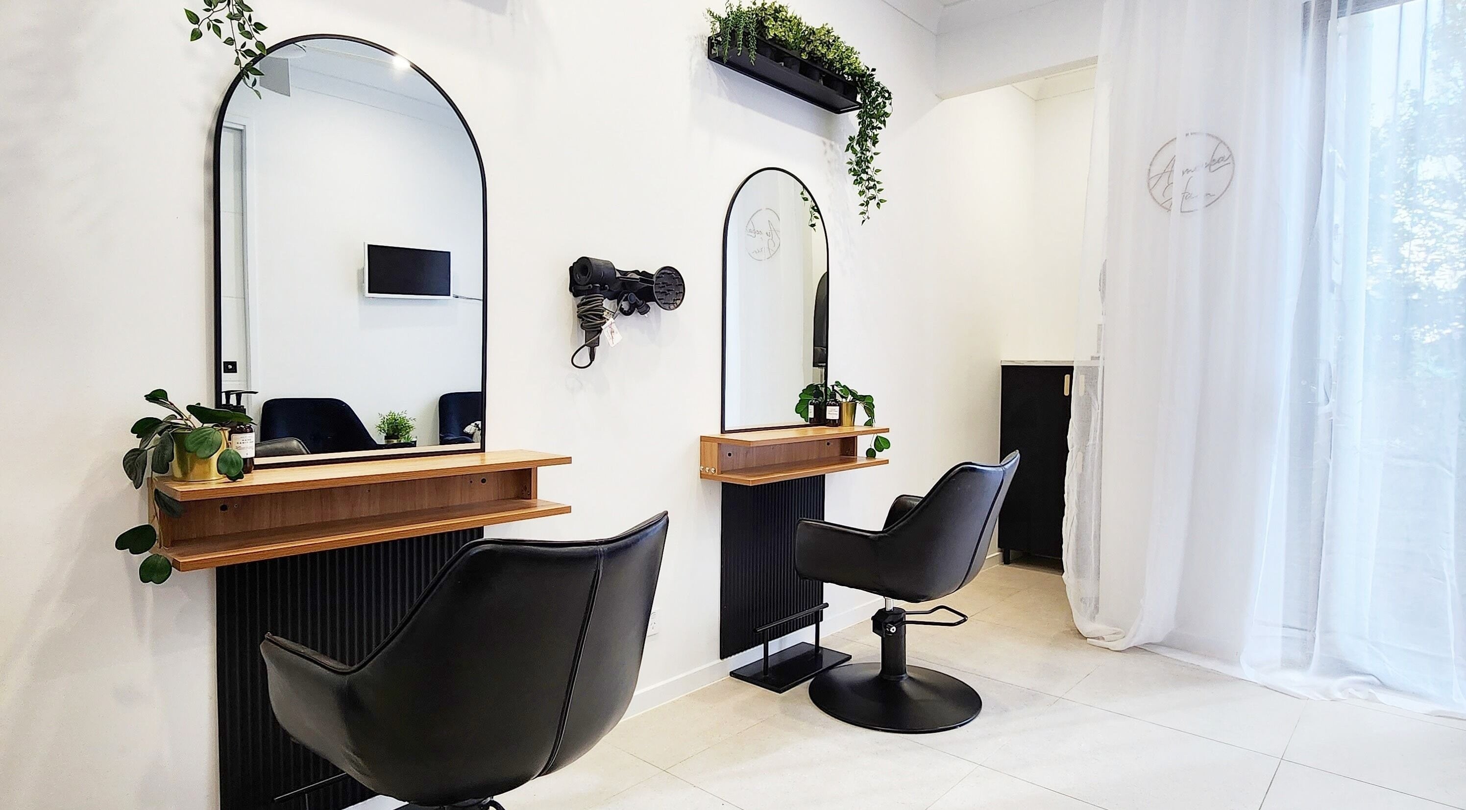 Modern styling chairs and mirrors at AimeeLea Hairdressing, Cornubia, Queensland, AU.