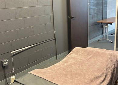 Relaxing massage room at TEAspot: Denver in Denver, Colorado, US. Cozy bed and calm ambiance.