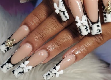 Intricate marble nail design with floral accents at Sheika's Artistic Designs, Wakefield, Trelawny Parish, JM.