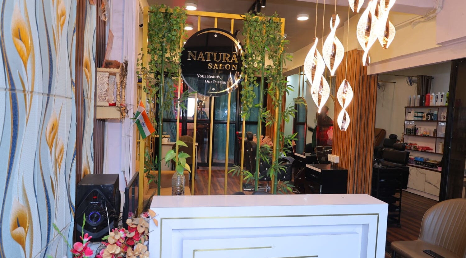 Reception with plants and modern lighting at Naturā Unisex Salon, Pune, Maharashtra, IN.