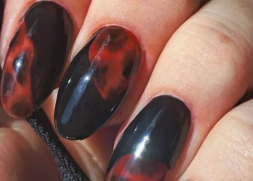 Unique flame-themed nails by Kerry Collett Nails, located in Galgate, England, GB. A bold and artistic look.