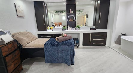 Spa treatment room at 50 Shades of Beauty and Slimming, Cape Town, Western Cape, ZA, featuring cozy decor.