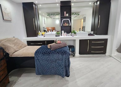 Luxurious spa room at 50 Shades of Beauty and Slimming in Cape Town, Western Cape, ZA featuring relaxing decor.