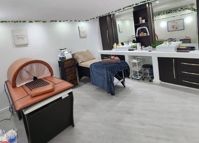 Tranquil spa room at 50 Shades of Beauty and Slimming, Cape Town, Western Cape, ZA featuring massage table and treatment area.