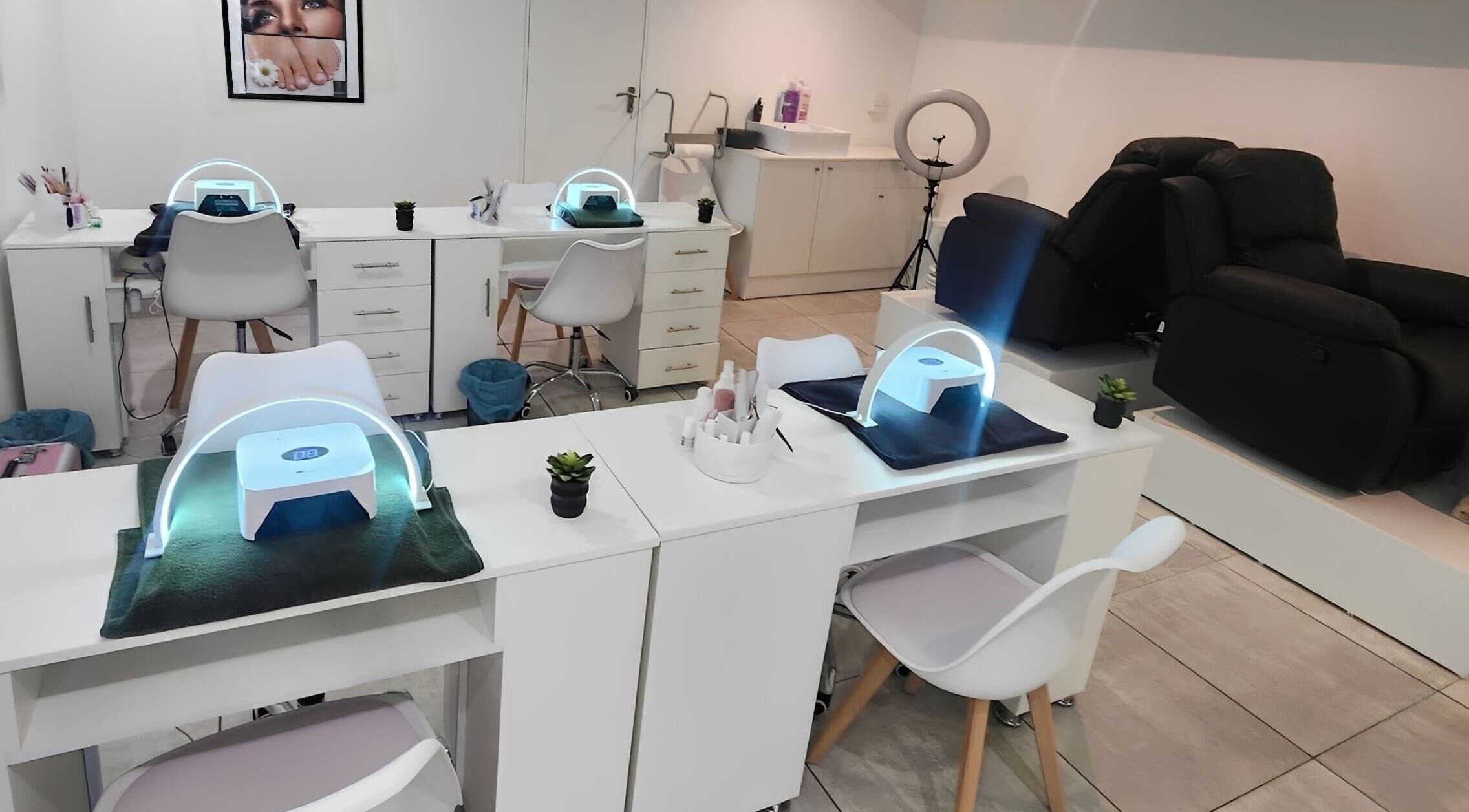 Modern nail salon setup at 50 Shades Of Beauty And Slimming, Cape Town, Western Cape, ZA with LED dryers.