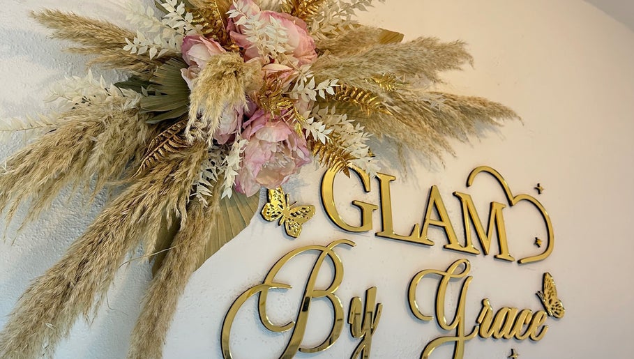 Elegant floral decor at Glam By Grace, Kings Langley, England, GB, showcasing gold lettering and delicate flowers.