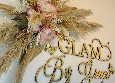 Elegant floral decor at Glam By Grace, Kings Langley, England, GB, showcasing gold lettering and delicate flowers.