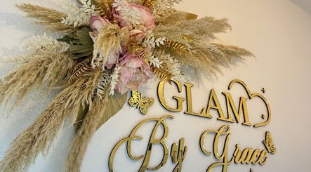Elegant floral decor at Glam By Grace, Kings Langley, England, GB, showcasing gold lettering and delicate flowers.