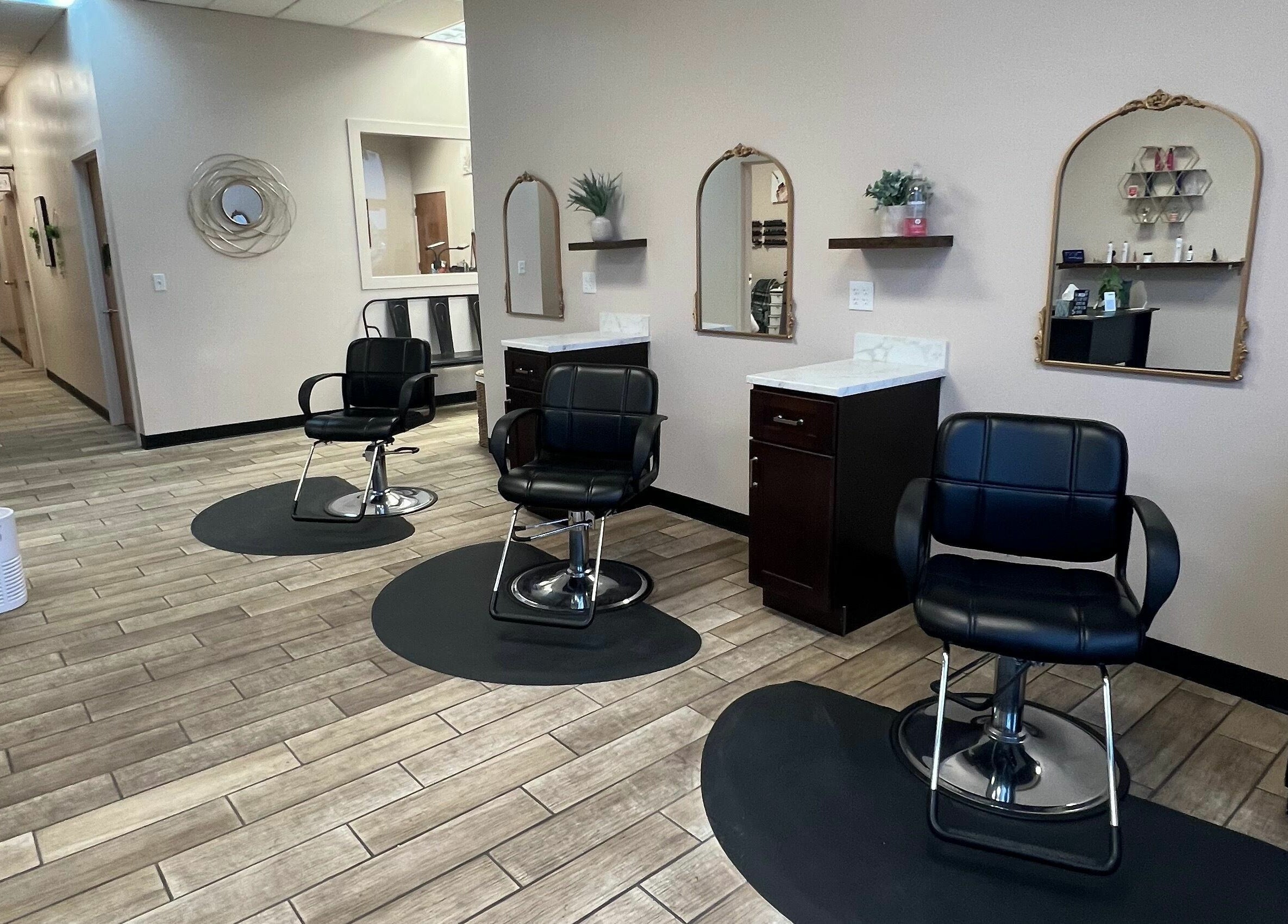 Elegant salon chairs at Urban Allure Salon and Studios in Roy, Utah, US, showcasing a modern, stylish interior.
