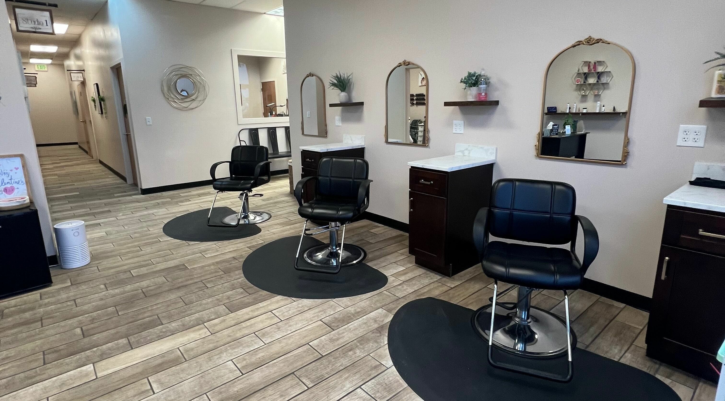 Elegant salon chairs at Urban Allure Salon and Studios in Roy, Utah, US, showcasing a modern, stylish interior.