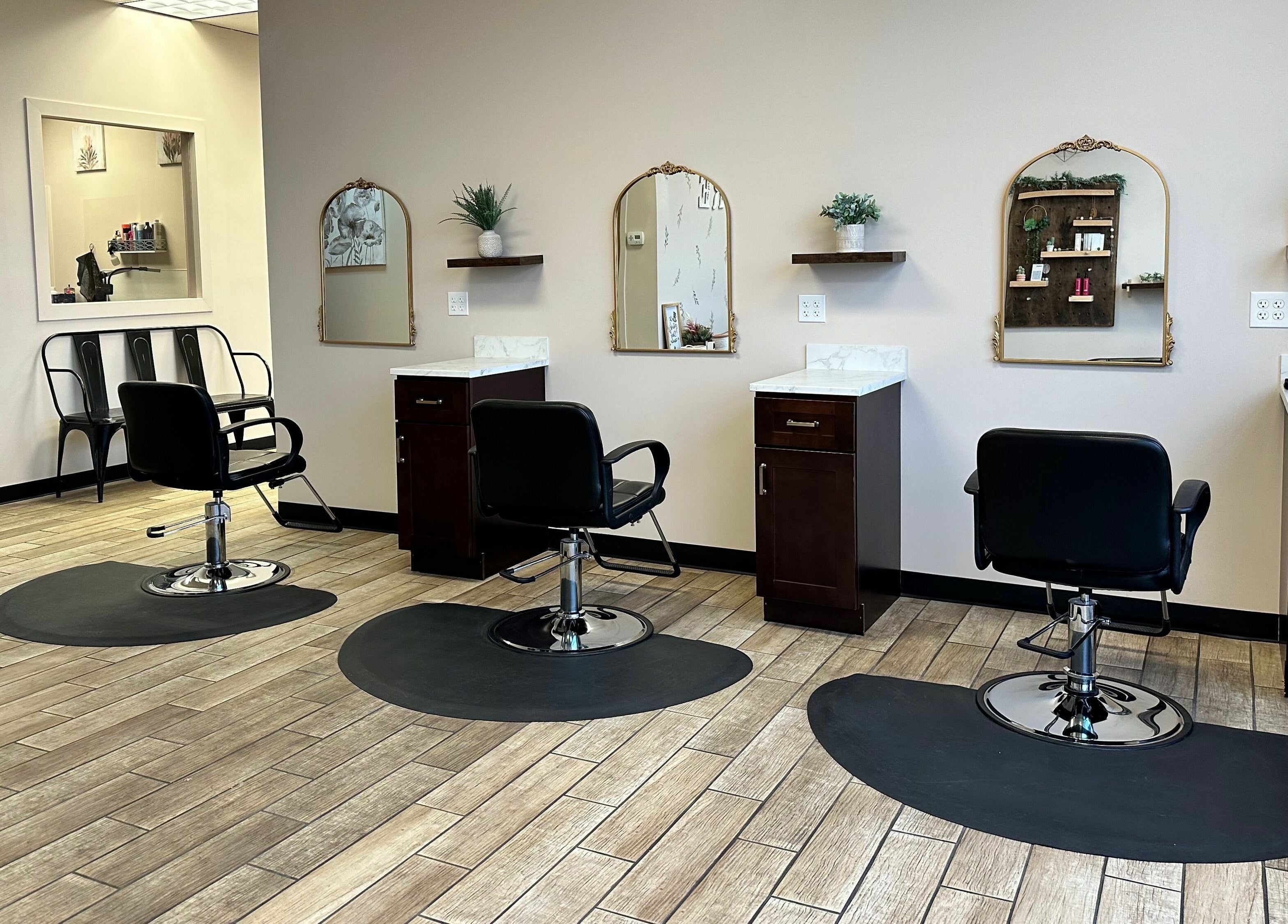 Modern styling chairs at Urban Allure Salon and Studios in Roy, Utah, US, offering chic beauty experiences.