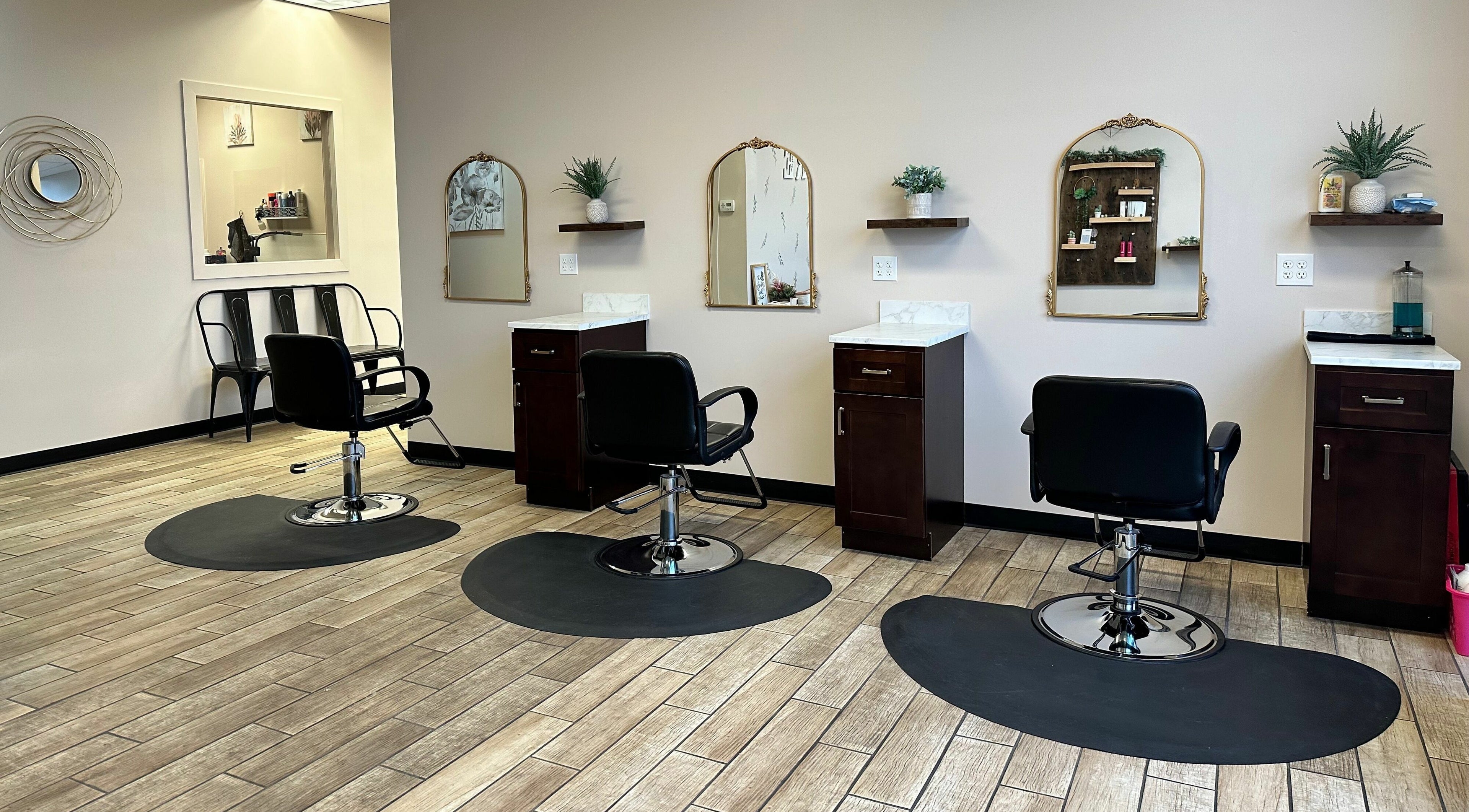 Modern styling chairs at Urban Allure Salon and Studios in Roy, Utah, US, offering chic beauty experiences.