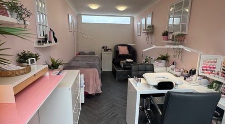 Peaceful interior of Utopia Beauty Farnham in Farnham, England, GB, featuring a treatment bed and nail station.