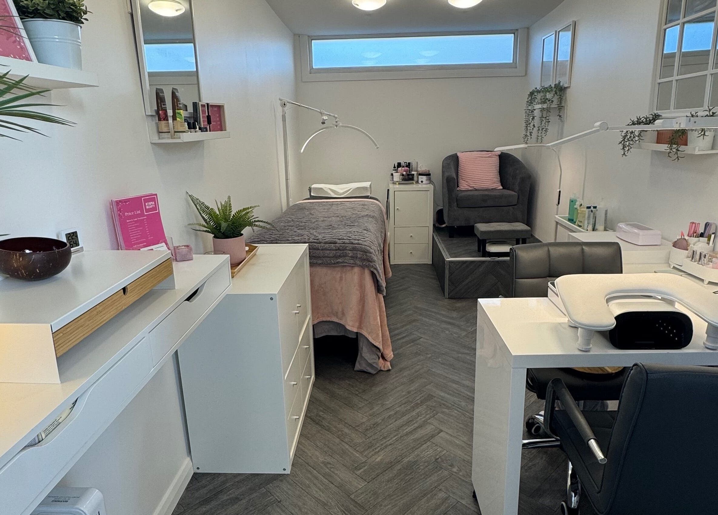 Relaxing treatment room at Utopia Beauty Farnham, Farnham, England, GB, featuring modern decor and amenities.