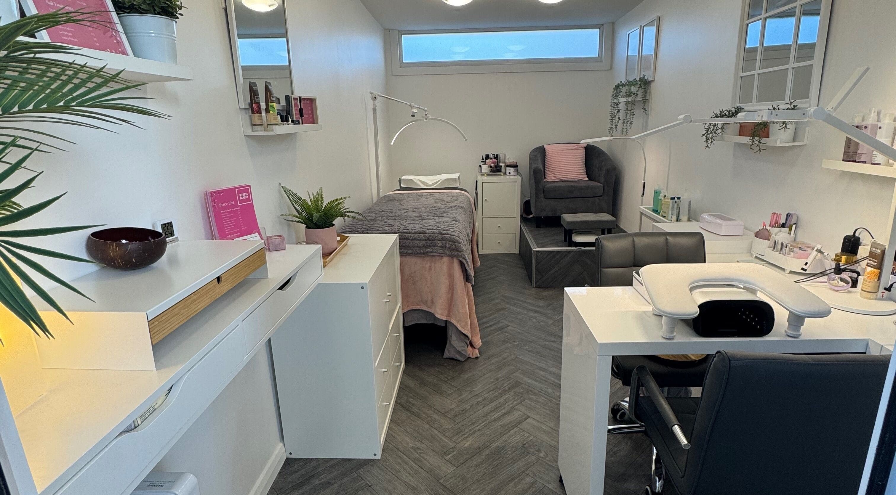 Relaxing treatment room at Utopia Beauty Farnham, Farnham, England, GB, featuring modern decor and amenities.